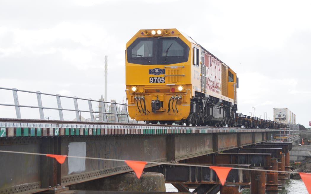 The first train to cross rail bridge 217, just south of Awatoto, Napier on 15 September 2023 after the bridge was restored having been badly damaged during Cyclone Gabrielle seven months earlier.
