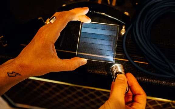 'Project silica' etches music data on thin glass slides the size of coasters.