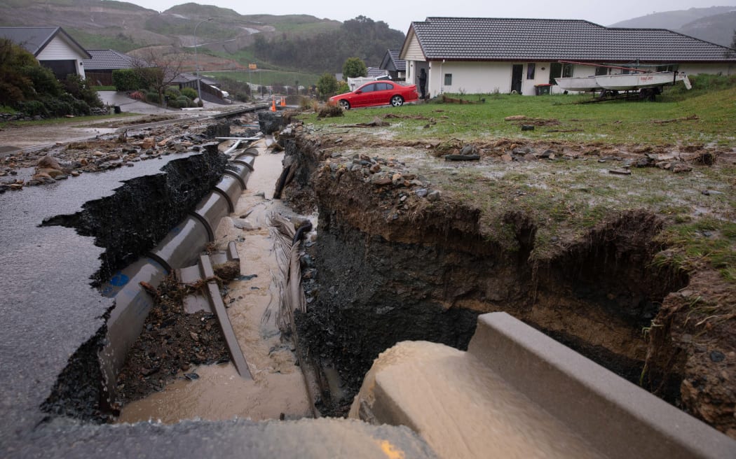 Flood waters have ripped open the road in Devenish Place, Atawhai, just north of Nelson