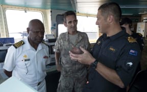 Matt Kaio (right), the New Zealand Maritime Security Operations Officer for APEC 2018, briefs Captain Phillip Polewara, the Chief of Staff of the Papua New Guinea Defence Force, and New Zealand Defence Force officer Colonel Jeremy Ramsden.