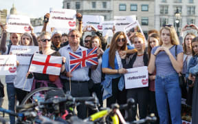 People gather in Trafalgar Square in London to pay tribute to the victims of the attack.