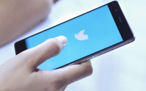 Twitter logo on a mobile phone