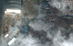This Maxar satellite image taken and released on February 27, 2022, shows the damage caused by recent airstrikes and heavy fighting at Antonov Airport in Hostomel, Ukraine.