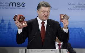 Petro Poroshenko shows passports of Russian soldiers to demonstrate the presence of Russian troops in the Ukraine.