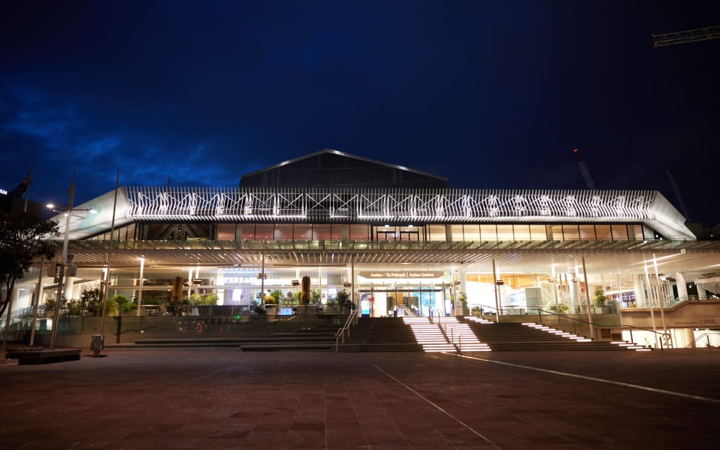 Auckland's Aotia Center is visible at night.