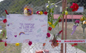 Flowers and messages at the cordon for the Whakaari/White Island eruption. 11.12.19