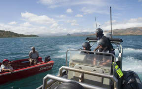 Crew from the Hawea talk to a local boatie in Fiji.