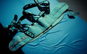 A bed with restraints, used in a Japanese psychiatric hospital