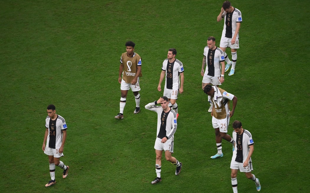 Germany players look dejected after Germany failed to qualify in the Qatar 2022 World Cup Group E football match between Costa Rica and Germany at the Al-Bayt Stadium in Al Khor, north of Doha on 1 December, 2022.