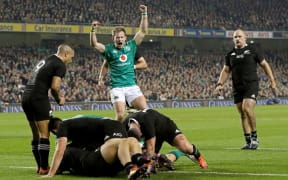 Ireland celebrate scoring the sole try in their match against the All Blacks in Dublin. 18 November 2018