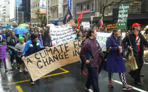 About 300 people marched up Auckland's Queen Street as part of a global protest urging more action on climate change.