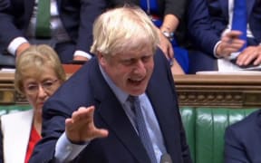 A video grab from footage broadcast by the UK Parliament's Parliamentary Recording Unit (PRU) shows Britain's Prime Minister Boris Johnson gestures as he gives a statement in the House of Commons in central London on September 25, 2019.