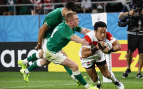 Japan's Kenki Fukuoka (R) scores a come-from-behind try during the first second  of the Rugby World Cup Pool A match against Ireland at Shizuoka Stadium Ecopa in Fukuroi in Shizuoka Prefecture on Sept. 28, 2019.
