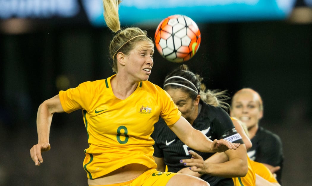 Australian Matildas player Elise Kellond-Knight goes up to head the ball against New Zealand.