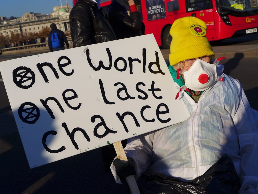 Climate activists gather in November, 2018 in London, blocking the traffic in a pacific protest, asking for the British Government to take action against climate change.