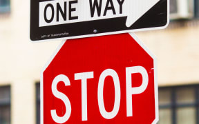 One way and stop signs