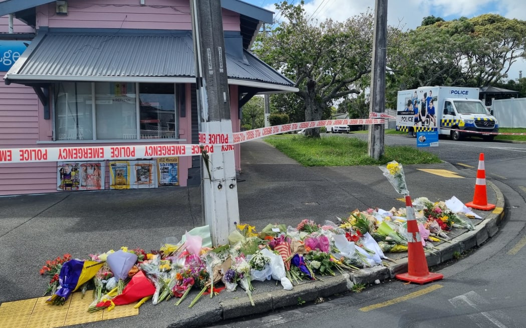 Flowers are seen outside Rose Cottage Superette in Sandringham, Auckland, after the fatal stabbing of a dairy worker on Wednesday, 23 November, 2022.