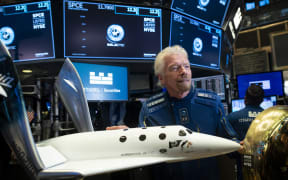 Richard Branson, Founder of Virgin Galactic poses before ringing the First Trade Bell to commemorate the Virgin Galactic's first day of trading on the New York Stock Exchange