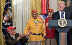 US President Donald Trump speaks in the Oval Office of the White House during an event to honor Native American code talkers who served in World War II