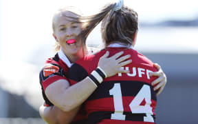 Becky Davidson of Canterbury is congratulated by Kendra Cocksedge (L) after scoring a try. Farah Palmer Cup.