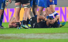 France's Remy Grosso (L) lays on the ground after running into All Blacks Ofa Tu'ungafasi (R  during the Steinlager Series rugby match between the All Blacks and France at the Eden Park in Auckland on Saturday the 9th of June 2018. Copyright Photo by Marty Melville / www.Photosport.nz