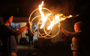 Andy and Felicity and their flaming bike wheel routine