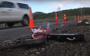 Road cones mark the site of the collision on Sunday in which seven people died.