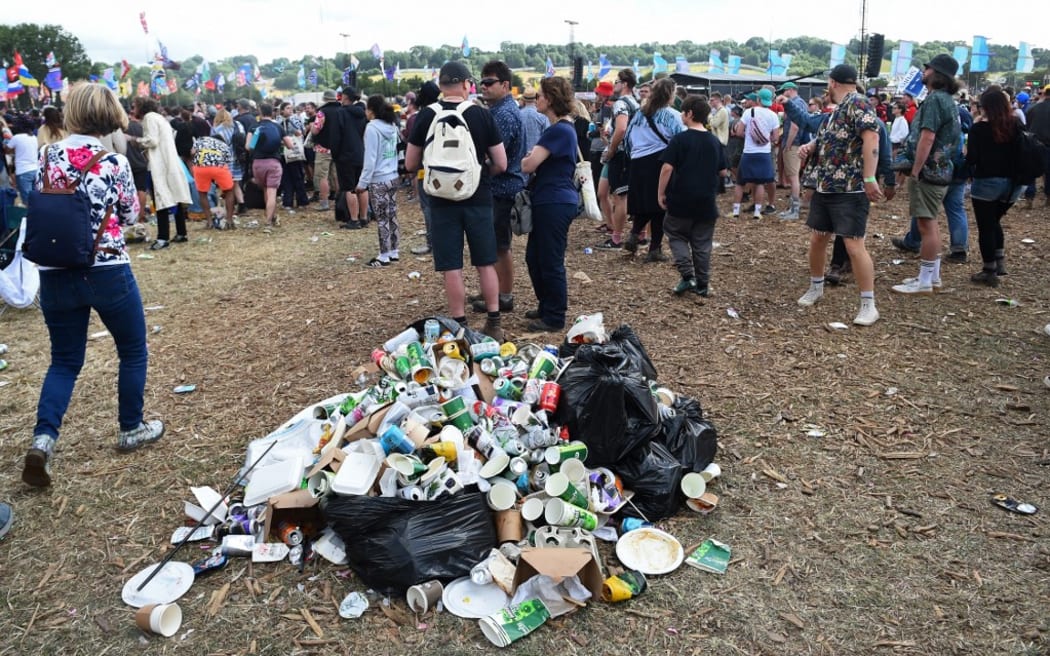 A rubbish collection point is pictured at the Glastonbury festival near the village of Pilton in Somerset, south-west England, on June 25, 2022. - More than 200,000 music fans descend on the English countryside this week as Glastonbury Festival returns after a three-year hiatus. The coronavirus pandemic forced organisers to cancel the last two years' events, and those going this year face an arduous journey battling three days of major rail strikes across the country. (Photo by ANDY BUCHANAN / AFP)