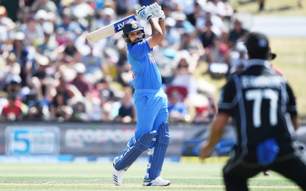 India's Rohit Sharma takes the attack to the New Zealand bowlers.