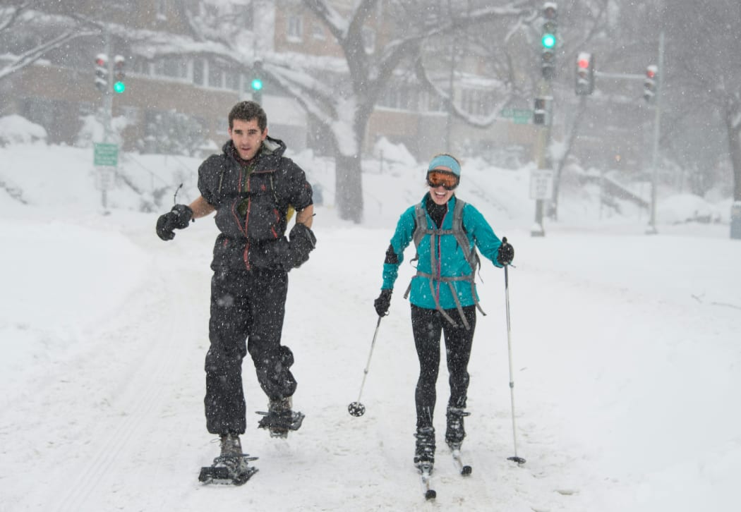 Skiing in the blizzard: a couple in Rock Creek Park, Washington DC.
