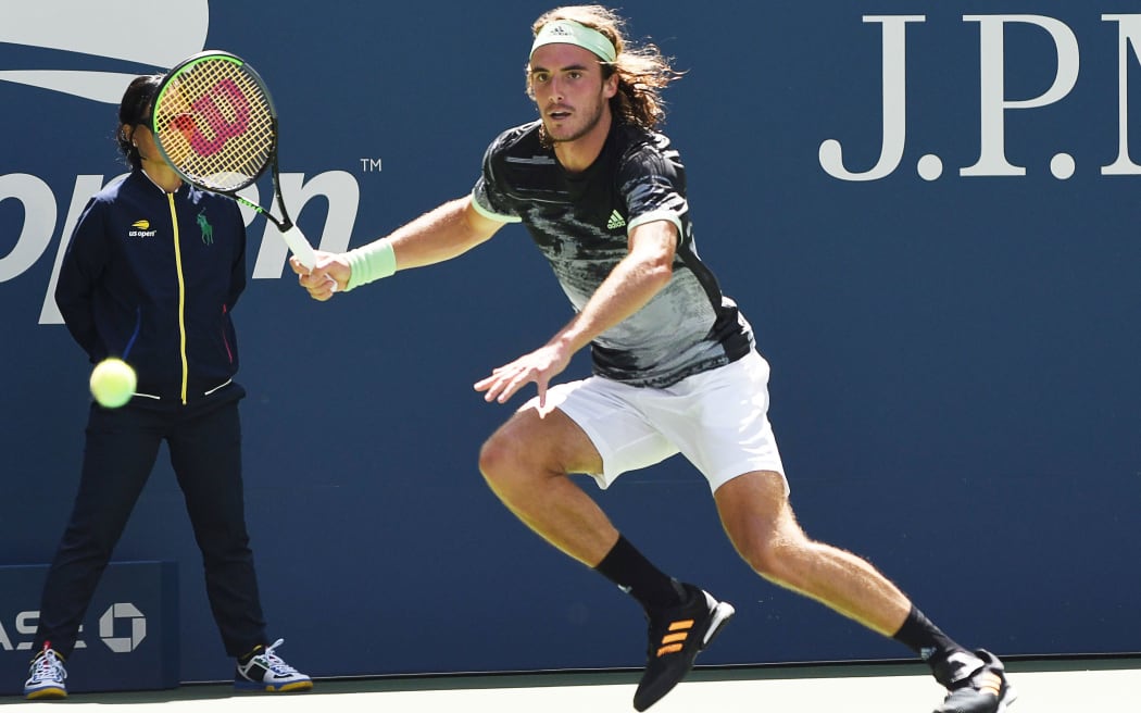 FLUSHING MEADOW, NY - AUGUST 27: Stefanos Tsitsipas (GRE) running for a wide forehand during his first round match at the US Open on August 27, 2019, at the Billie Jean King Tennis Center in Flushing Meadow, NY. (Photo by Cynthia Lum/Icon Sportswire) (Photo by Cynthia Lum/Icon Sportswire