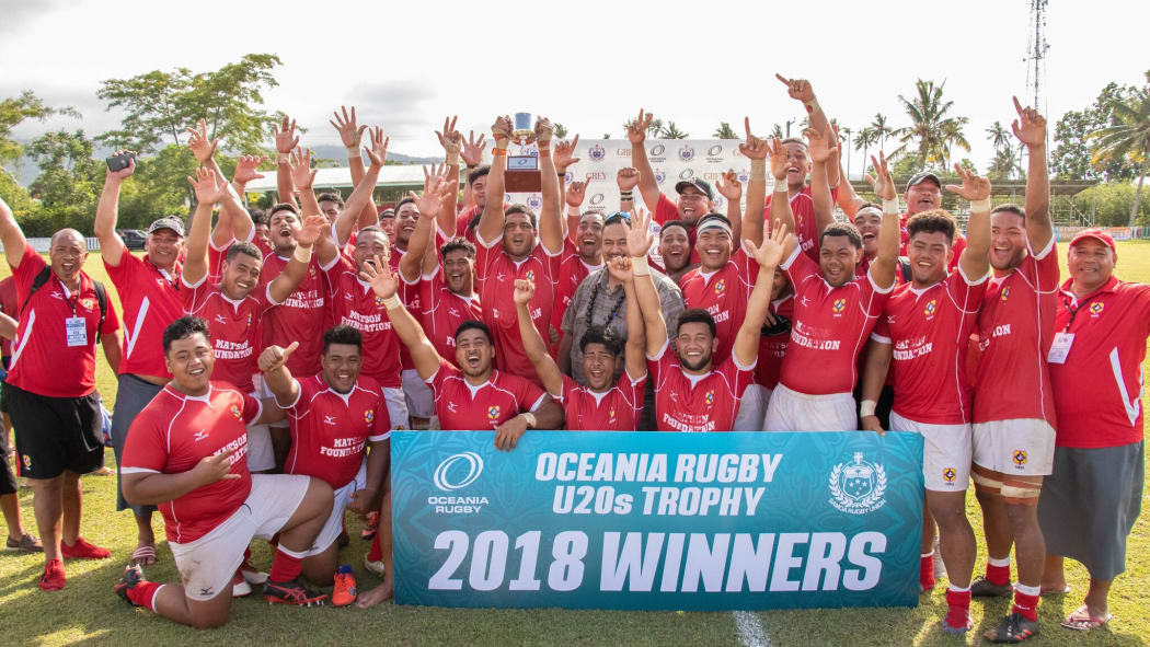Tonga celebrate their win.