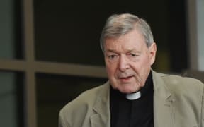 George Pell's body lying in state at St Mary's Cathedral as protesters, police head to court