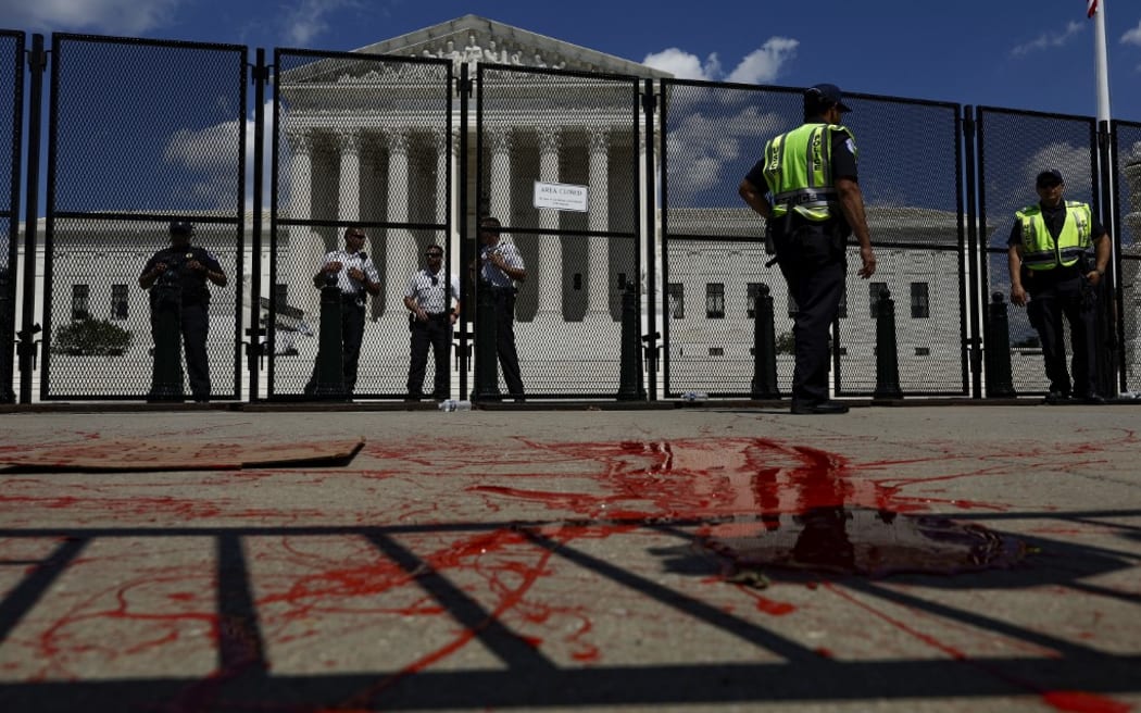 Red paint thrown by an abortion-rights activist is seen in front of the Supreme Court building.