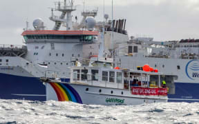 A Greenpeace boat following an oil exploration vessel