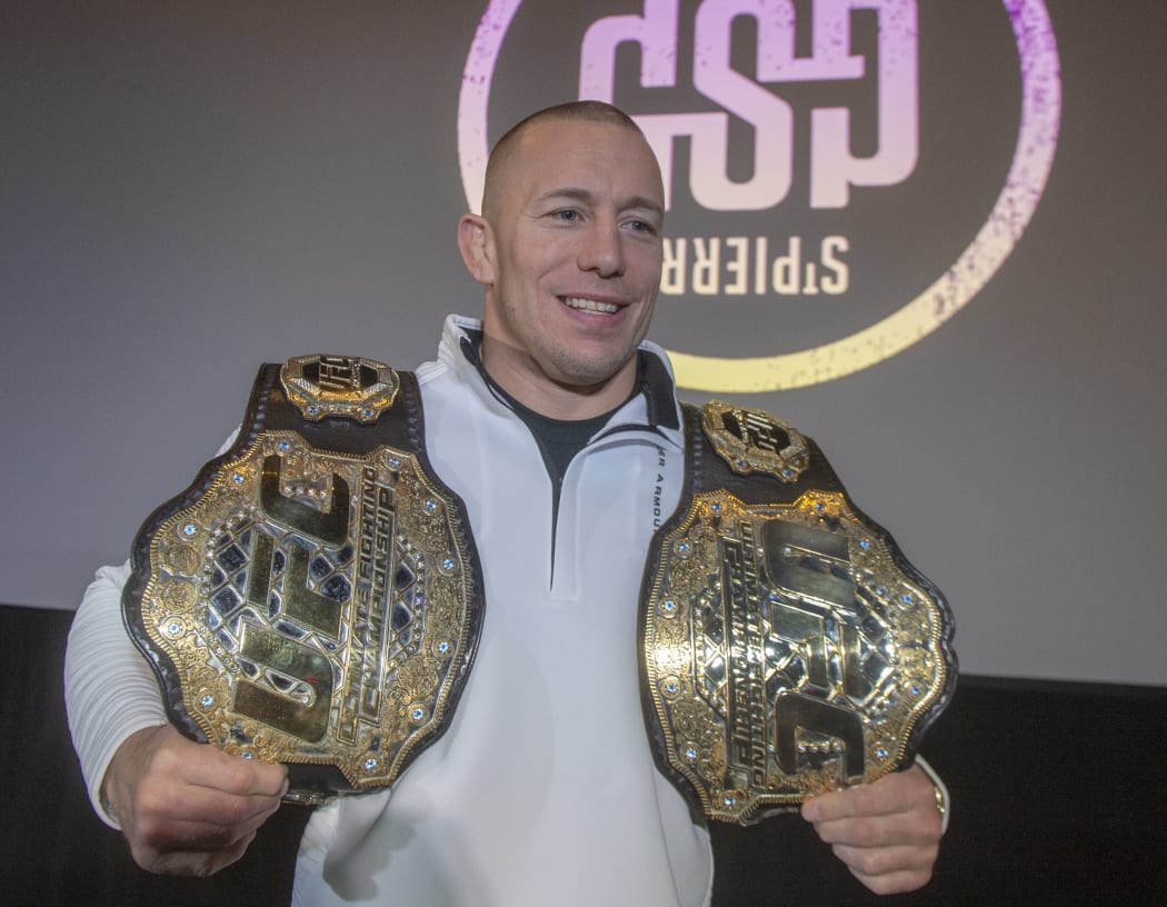 Canada's Georges St-Pierre announces his retirement from mixed martial arts during a press conference in Montreal.
