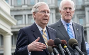 US Senate majority leader Mitch McConnell and majority whip John Cornyn speak to the press outside the West Wing of the White House after Republican senators met with US President Donald Trump to discuss the healthcare bill in Washington, DC.