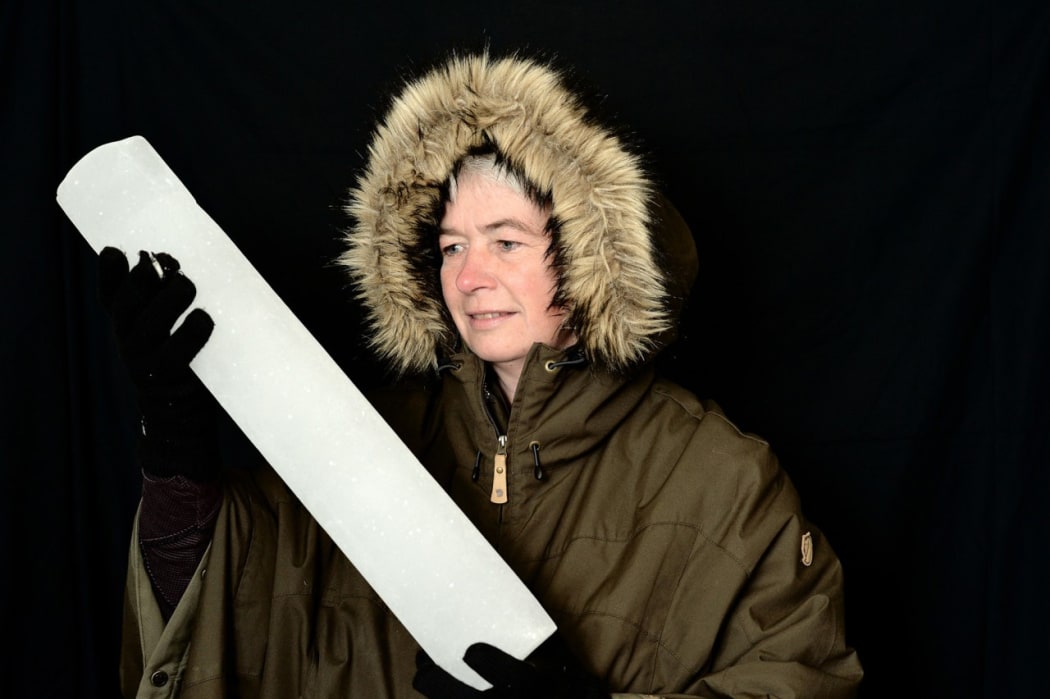 Dorthe Dahl-Jensen holds an ice core from the Greenland ice cap.