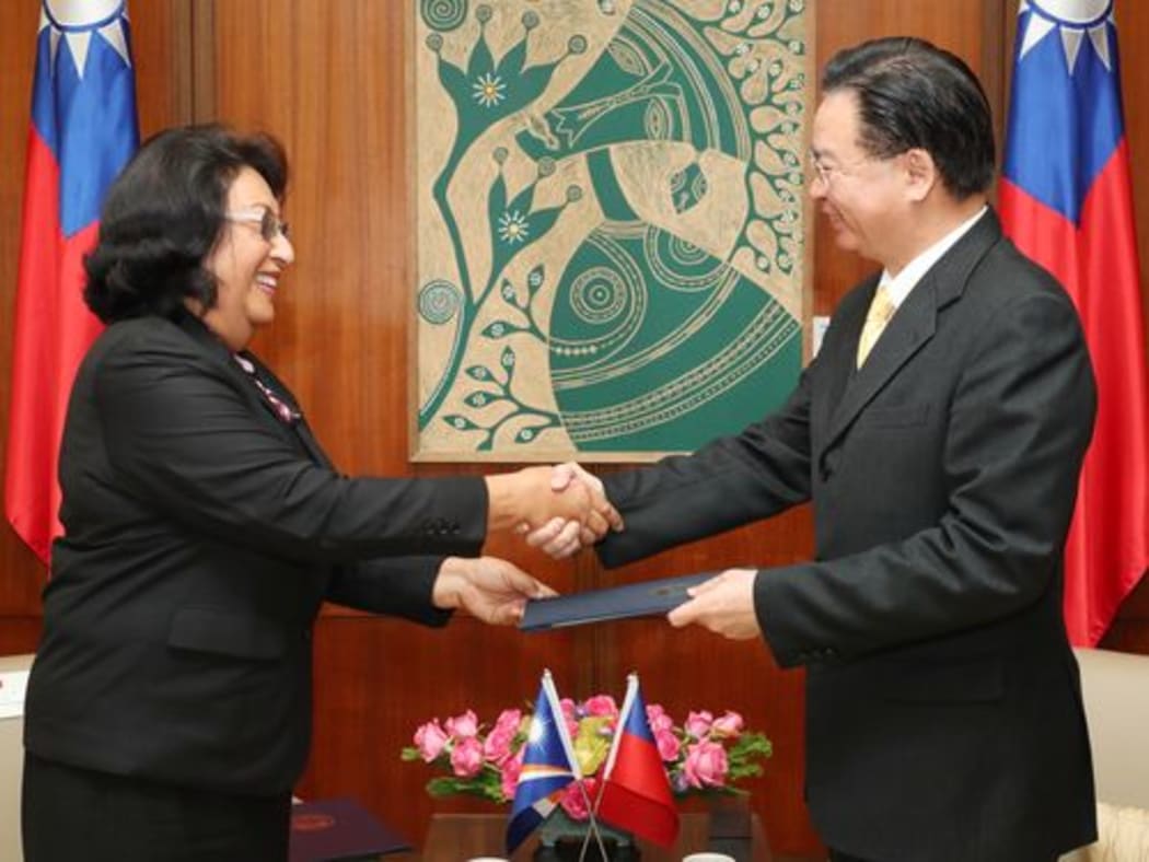Marshall islands’ new ambassador to Taiwan, Neijon Rema Edwards, left, presents her credentials to Foreign Minister, Joseph Wu, in Taipei.
