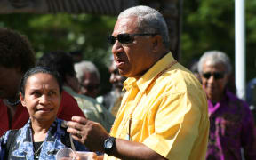 West Papuan activist Paula Makabori looks at Fiji leader Frank Bainimarama.