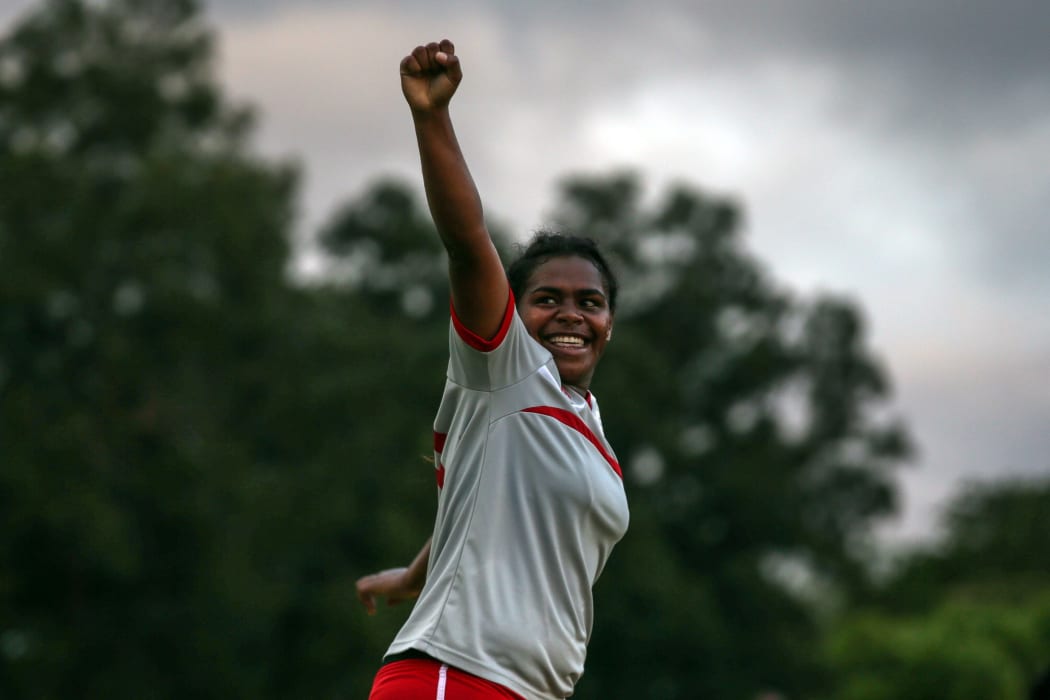 New Caledonia's Ami-Nata Ajapuhnya celebrates scoring the opening goal of the match.