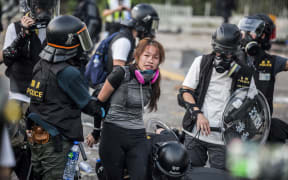 Police detain demonstrators in the Sha Tin district of Hong Kong as violent demonstrations take place in the streets of the city on the National Day holiday to mark the 70th anniversary of communist China's founding.