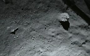 A photo by the ROLIS (Rosetta Lander Imaging System) instrument shows the surface of the comet during Philae's descent.