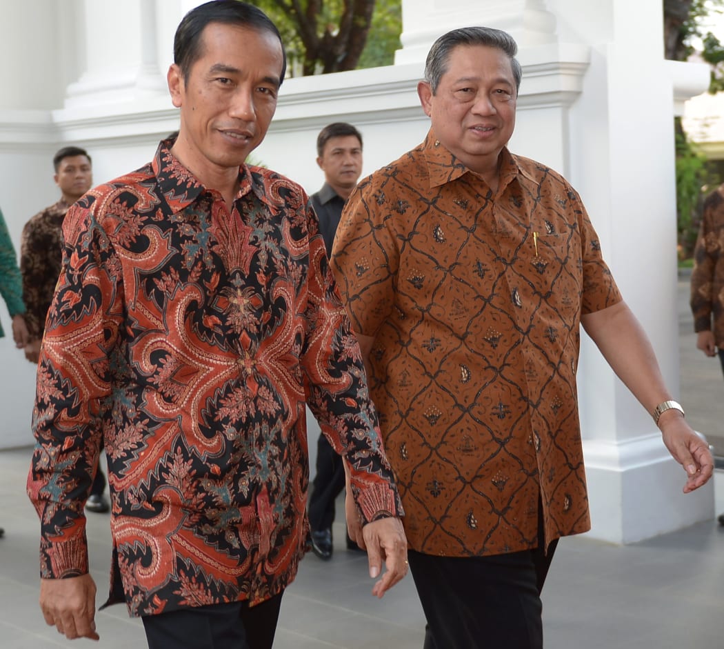 Incoming Indonesian President Joko Widodo. left, and outgoing president Susilo Bambang Yudhoyono.