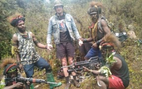 New Zealand pilot Philip Mehrtens was photographed with his rebel captors in Indonesia's Papua region.