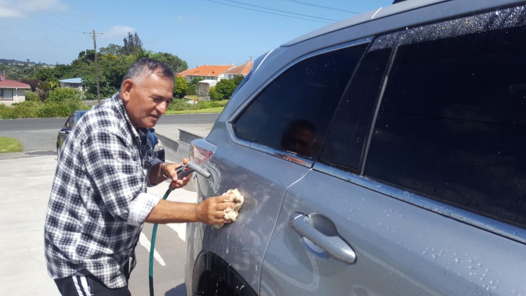 Waitara resident Rex Brunning washes his car more often than usual to get some mysterious yellow droppings off it.