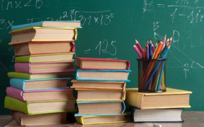 School books and a chalkboard