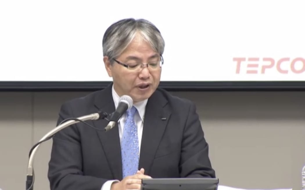 Tokyo Electric Power Company Holdings (TEPCO) spokesperson Junichi Matsumoto briefs media on August 23.
