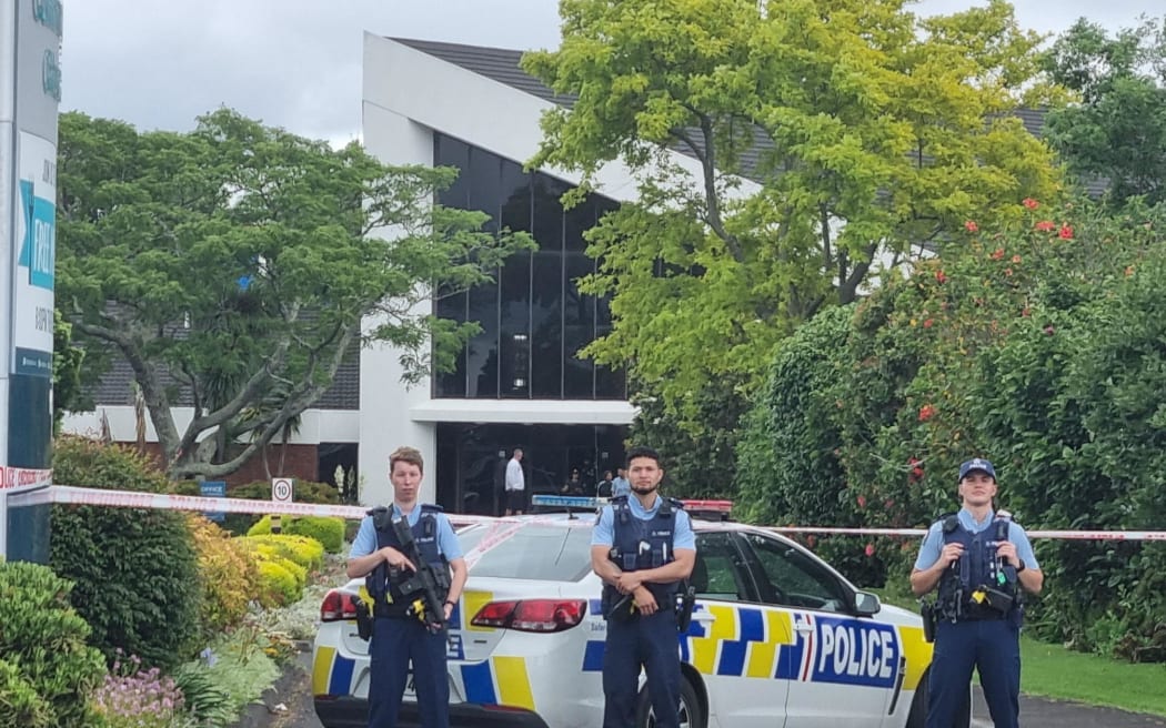 Armed police outside the Papatoetoe Seventh Day Adventist Community Church after a person was shot dead.