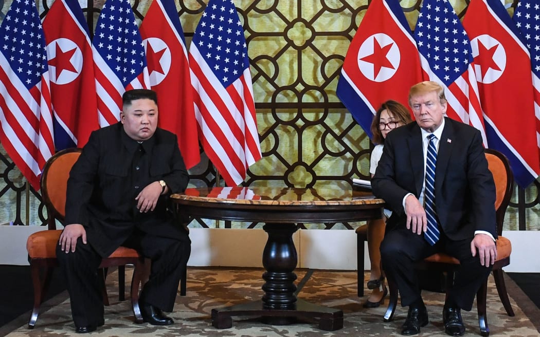 US President Donald Trump (R) and North Korea's leader Kim Jong Un hold a meeting during the second US-North Korea summit at the Sofitel Legend Metropole hotel in Hanoi on February 28, 2019.